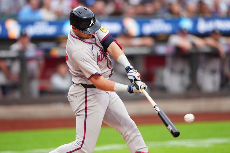 Jul 25, 2024; New York City, New York, USA; Atlanta Braves third baseman Austin Riley (27) hits a double against the New York Mets  during the first inning at Citi Field. Mandatory Credit: Gregory Fisher-USA TODAY Sports