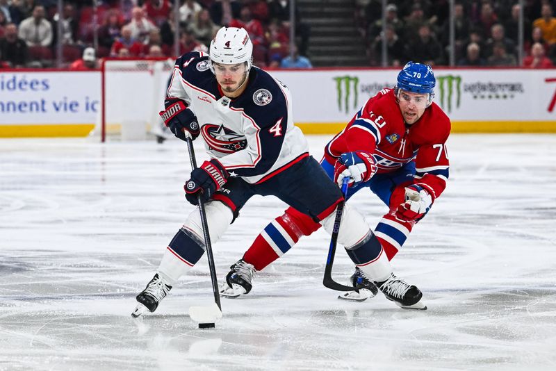 Mar 12, 2024; Montreal, Quebec, CAN; Montreal Canadiens left wing Tanner Pearson (70) defends against Columbus Blue Jackets center Cole Sillinger (4) during the second period at Bell Centre. Mandatory Credit: David Kirouac-USA TODAY Sports