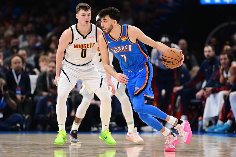 OKLAHOMA CITY, OKLAHOMA - JANUARY 31: Chet Holmgren #7 of the Oklahoma City Thunder handles the ball in front of Christian Braun #0 of the Denver Nuggets during the second half at Paycom Center on January 31, 2024 in Oklahoma City, Oklahoma. NOTE TO USER: User expressly acknowledges and agrees that, by downloading and or using this Photograph, user is consenting to the terms and conditions of the Getty Images License Agreement. (Photo by Joshua Gateley/Getty Images)