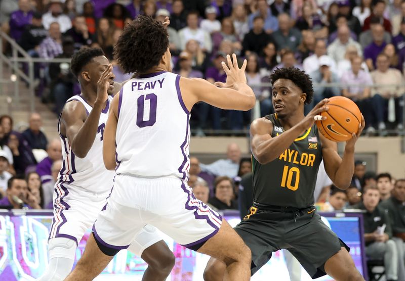 Feb 11, 2023; Fort Worth, Texas, USA;  Baylor Bears guard Adam Flagler (10) looks to pass as TCU Horned Frogs guard Damion Baugh (10) and TCU Horned Frogs guard Micah Peavy (0) defend during the second half at Ed and Rae Schollmaier Arena. Mandatory Credit: Kevin Jairaj-USA TODAY Sports