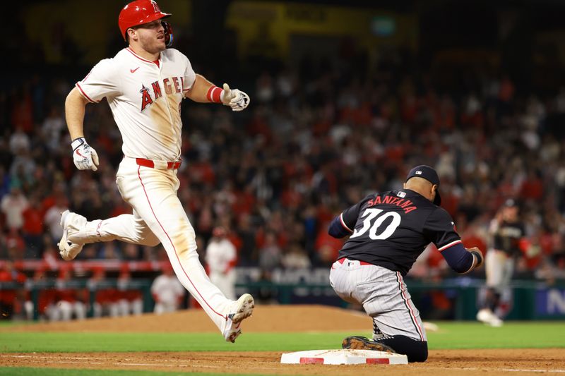 Apr 26, 2024; Anaheim, California, USA;  Los Angeles Angels outfielder Mike Trout (27) is out at first base to end the game against the Minnesota Twins at Angel Stadium. Mandatory Credit: Kiyoshi Mio-USA TODAY Sports