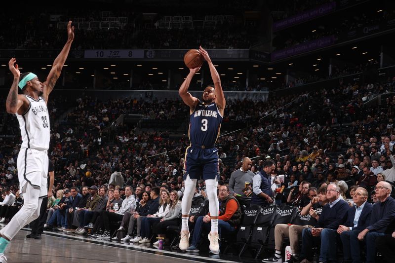 BROOKLYN, NY - MARCH 19: CJ McCollum #3 of the New Orleans Pelicans shoots a three point basket during the game against the Brooklyn Nets on March 19, 2024 at Barclays Center in Brooklyn, New York. NOTE TO USER: User expressly acknowledges and agrees that, by downloading and or using this Photograph, user is consenting to the terms and conditions of the Getty Images License Agreement. Mandatory Copyright Notice: Copyright 2024 NBAE (Photo by Nathaniel S. Butler/NBAE via Getty Images)