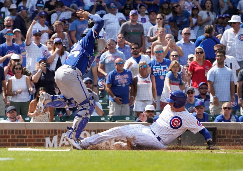 Aug 19, 2023; Chicago, Illinois, USA; Chicago Cubs catcher Yan Gomes (15) is safe at home plate as Kansas City Royals catcher Freddy Fermin (34) takes the throw during the fourth inning at Wrigley Field. Mandatory Credit: David Banks-USA TODAY Sports