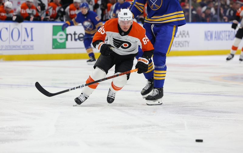 Apr 5, 2024; Buffalo, New York, USA;  Philadelphia Flyers right wing Cam Atkinson (89) goes after a loose pick during the third period against the Buffalo Sabres at KeyBank Center. Mandatory Credit: Timothy T. Ludwig-USA TODAY Sports