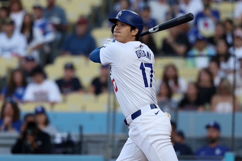 Jul 2, 2024; Los Angeles, California, USA;  Los Angeles Dodgers designated hitter Shohei Ohtani (17) hits a double during the first inning against the Arizona Diamondbacks at Dodger Stadium. Mandatory Credit: Kiyoshi Mio-USA TODAY Sports