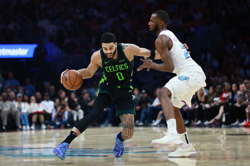 MIAMI, FLORIDA - FEBRUARY 10: Jayson Tatum #0 of the Boston Celtics drives around Andrew Wiggins #22 of the Miami Heat during the second half at Kaseya Center on February 10, 2025 in Miami, Florida. NOTE TO USER: User expressly acknowledges and agrees that, by downloading and or using this Photograph, user is consenting to the terms and conditions of the Getty Images License Agreement. (Photo by Carmen Mandato/Getty Images)