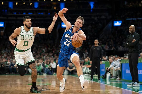 BOSTON, MASSACHUSETTS - DECEMBER 17: Franz Wagner #22 of the Orlando Magic drives to the basket against Jayson Tatum #0 of the Boston Celtics during the first half at TD Garden on December 17, 2023 in Boston, Massachusetts. NOTE TO USER: User expressly acknowledges and agrees that, by downloading and or using this photograph, user is consenting to the terms and conditions of the Getty Images License Agreement. (Photo by Maddie Malhotra/Getty Images)