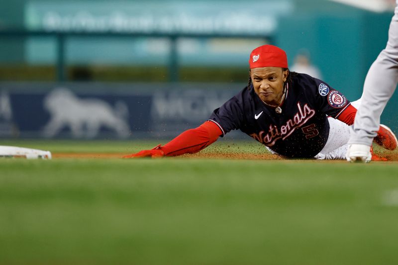 Sep 19, 2023; Washington, District of Columbia, USA; Washington Nationals shortstop CJ Abrams (5) dives into third base with a triple ahead of a tag by Chicago White Sox third baseman Yoan Moncada (not pictured) during the first inning at Nationals Park. Mandatory Credit: Geoff Burke-USA TODAY Sports