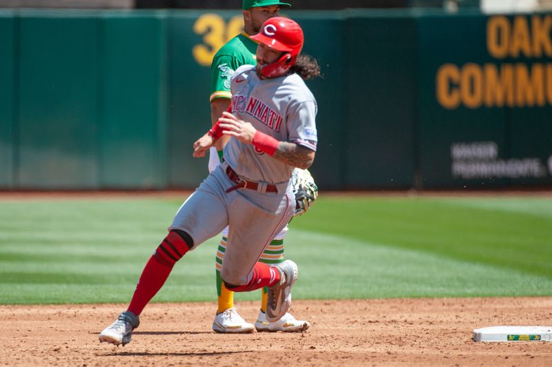 Apr 29, 2023; Oakland, California, USA; Cincinnati Reds second baseman Jonathan India (6) advances on a throwing error during the third inning at RingCentral Coliseum. Mandatory Credit: Ed Szczepanski-USA TODAY Sports