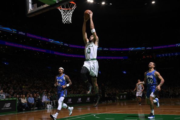 BOSTON, MA - DECEMBER 17: Jayson Tatum #0 of the Boston Celtics dunks the ball during the game against the Orlando Magic on December 17, 2023 at the TD Garden in Boston, Massachusetts. NOTE TO USER: User expressly acknowledges and agrees that, by downloading and or using this photograph, User is consenting to the terms and conditions of the Getty Images License Agreement. Mandatory Copyright Notice: Copyright 2023 NBAE  (Photo by Brian Babineau/NBAE via Getty Images)