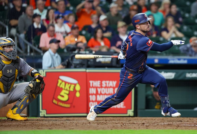 May 13, 2024; Houston, Texas, USA; Houston Astros third baseman Alex Bregman (2) hits a two run RBI double against the Oakland Athletics in the eighth inning at Minute Maid Park. Mandatory Credit: Thomas Shea-USA TODAY Sports