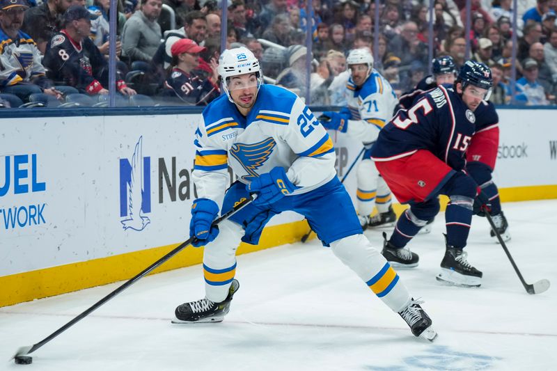 Nov 1, 2025; Columbus, Ohio, USA;  St. Louis Blues right wing Jordan Kyrou (25) skates with the puck against the Columbus Blue Jackets in the first period at Nationwide Arena. Mandatory Credit: Aaron Doster-Imagn Images
