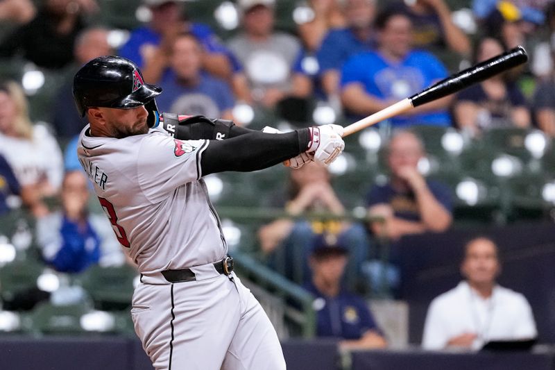 Sep 19, 2024; Milwaukee, Wisconsin, USA;  Arizona Diamondbacks first baseman Christian Walker (53) hits a sacrifice fly ball during the fifth inning against the Milwaukee Brewers at American Family Field. Mandatory Credit: Jeff Hanisch-Imagn Images