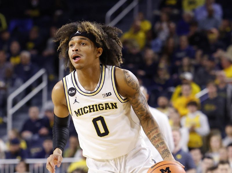 Feb 8, 2023; Ann Arbor, Michigan, USA;  Michigan Wolverines guard Dug McDaniel (0) dribbles in the first half against the Nebraska Cornhuskers at Crisler Center. Mandatory Credit: Rick Osentoski-USA TODAY Sports