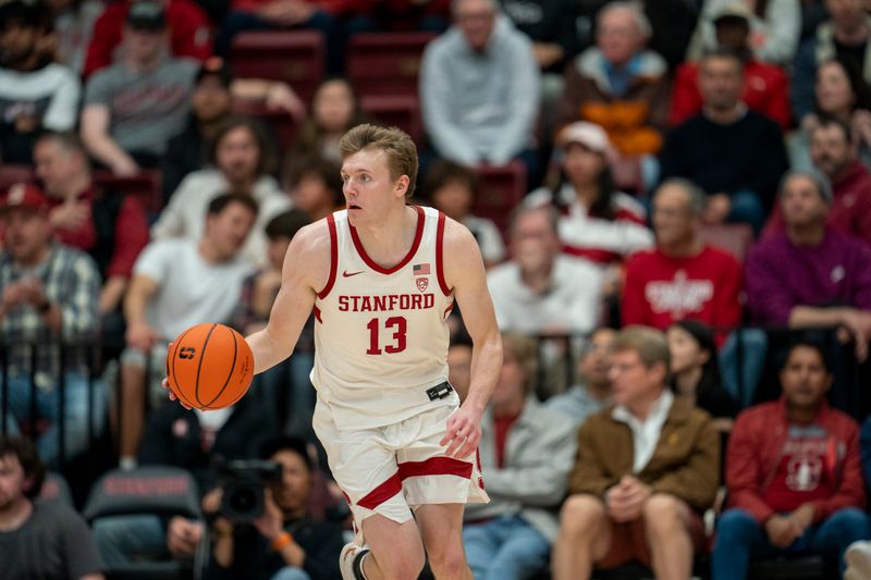 Mar 7, 2024; Stanford, California, USA; Stanford Cardinal guard Michael Jones (13) dribbles the basketball up the court against the California Golden Bears during the second quarter at Maples Pavillion. Mandatory Credit: Neville E. Guard-USA TODAY Sports