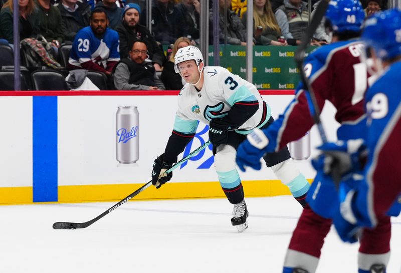 Nov 5, 2024; Denver, Colorado, USA; Seattle Kraken defenseman Will Borgen (3) prepares to take a shot on goal in the third period against the Colorado Avalanche at Ball Arena. Mandatory Credit: Ron Chenoy-Imagn Images