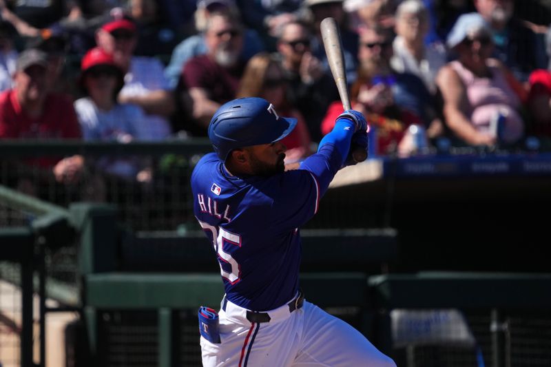 Mar 4, 2024; Surprise, Arizona, USA; Texas Rangers left fielder Derek Hill (75) bats against the Los Angeles Angels during the third inning at Surprise Stadium. Mandatory Credit: Joe Camporeale-USA TODAY Sports
