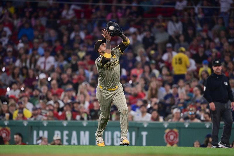 Jun 28, 2024; Boston, Massachusetts, USA; San Diego Padres first baseman Luis Arraez (4) makes a catch against the Boston Red Sox during the eighth inning at Fenway Park. Mandatory Credit: Eric Canha-USA TODAY Sports