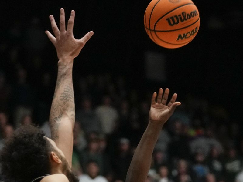 Feb 27, 2024; Fort Collins, Colorado, USA; Colorado State Rams guard Isaiah Stevens (4) shoots over Nevada Wolf Pack forward K.J. Hymes (42) during the second half  at Moby Arena. Mandatory Credit: Michael Madrid-USA TODAY Sports