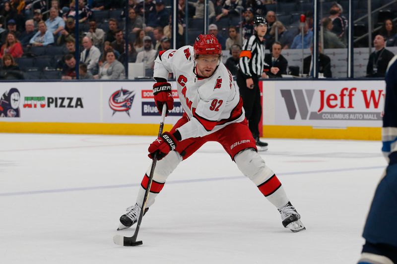 Apr 16, 2024; Columbus, Ohio, USA; Carolina Hurricanes center Evgeny Kuznetsov (92) passes the puck against the Columbus Blue Jackets during the first period at Nationwide Arena. Mandatory Credit: Russell LaBounty-USA TODAY Sports