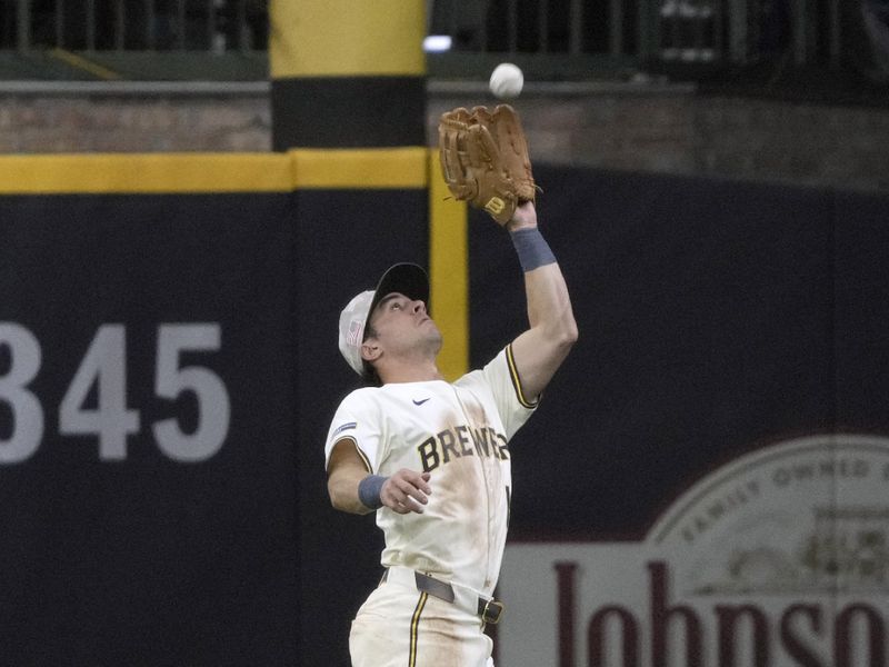 May 18, 2025; Milwaukee, Wisconsin, USA; Milwaukee Brewers outfielder Sal Frelick (10) catches a fly ball against the Minnesota Twins in the fourth inning at American Family Field. Mandatory Credit: Michael McLoone-Imagn Images