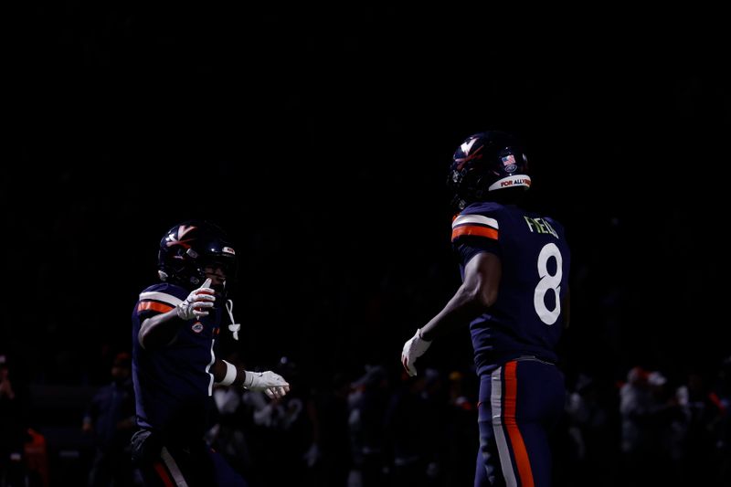 Nov 25, 2023; Charlottesville, Virginia, USA; Virginia Cavaliers wide receiver Malachi Fields (8) celebrates with Cavaliers wide receiver Suderian Harrison (1) after catching a touchdown pass against the Virginia Tech Hokies during the third quarter at Scott Stadium. Mandatory Credit: Geoff Burke-USA TODAY Sports