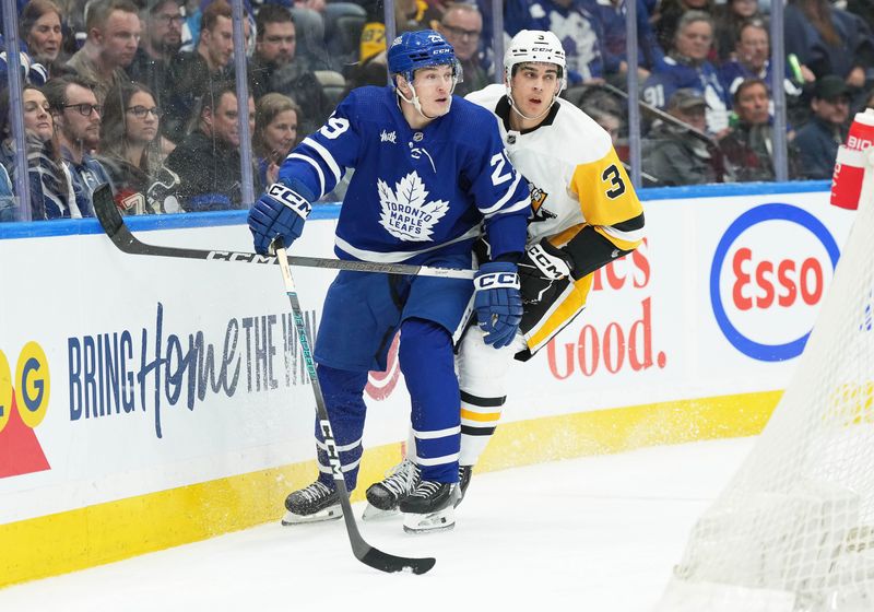 Apr 8, 2024; Toronto, Ontario, CAN; Pittsburgh Penguins defenseman Jack St. Ivany (3) battles behind the net with Toronto Maple Leafs right wing Pontus Holmberg (29) during the third period at Scotiabank Arena. Mandatory Credit: Nick Turchiaro-USA TODAY Sports