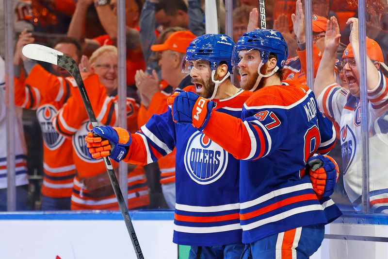 May 29, 2024; Edmonton, Alberta, CAN; The Edmonton Oilers celebrate a goal scored by defensemen Evan Bouchard (2) during the first period against the Dallas Stars in game four of the Western Conference Final of the 2024 Stanley Cup Playoffs at Rogers Place. Mandatory Credit: Perry Nelson-USA TODAY Sports
