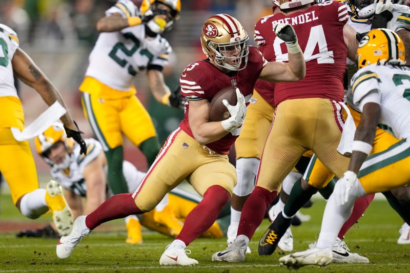 San Francisco 49ers running back Christian McCaffrey (23) runs the ball during an NFL football game against the Green Bay Packers Sunday, Jan. 21, 2024, in Inglewood, Calif. (AP Photo/Ashley Landis)