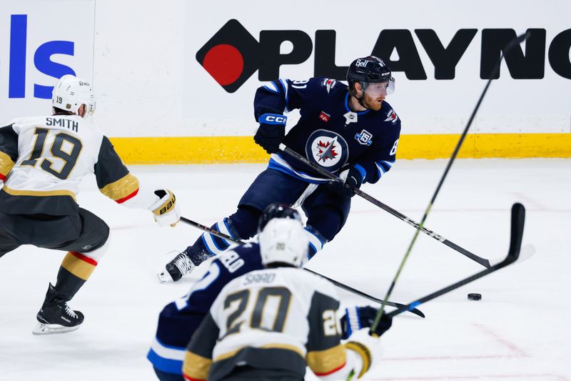 Jan 6, 2026; Winnipeg, Manitoba, CAN;  Winnipeg Jets forward Kyle Connor (81) skates away from Vegas Golden Knights forward Reilly Smith (19) during the second period at Canada Life Centre. Mandatory Credit: Terrence Lee-Imagn Images