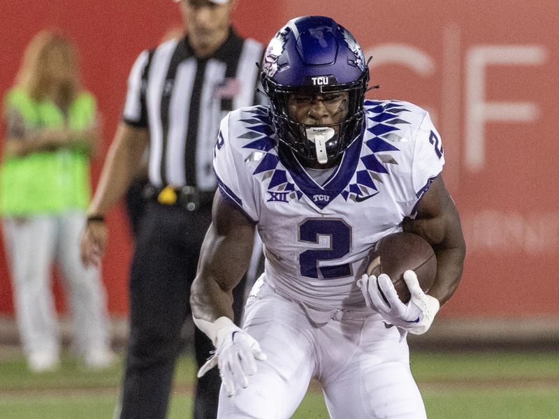 Sep 16, 2023; Houston, Texas, USA; TCU Horned Frogs running back Trey Sanders (2) rushes against the Houston Cougars in the first half at TDECU Stadium. Mandatory Credit: Thomas Shea-USA TODAY Sports