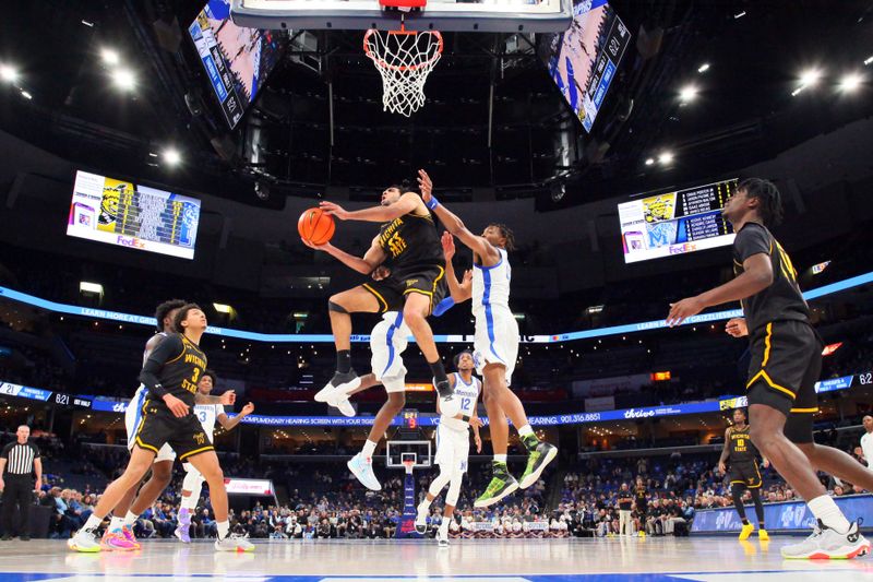 Jan 19, 2023; Memphis, Tennessee, USA; Wichita State Shockers forward James Rojas (33) shoots as Memphis Tigers forward Chandler Lawson (4) defends during the first half at FedExForum. Mandatory Credit: Petre Thomas-USA TODAY Sports