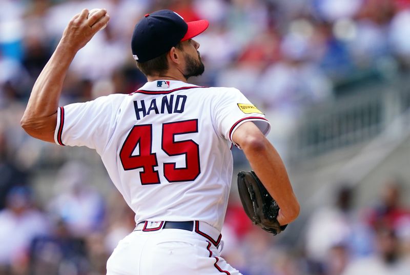 Sep 10, 2023; Cumberland, Georgia, USA; Atlanta Braves relief pitcher Brad Hand (45) pitching against the Pittsburgh Pirates during the seventh inning at Truist Park. Mandatory Credit: John David Mercer-USA TODAY Sports