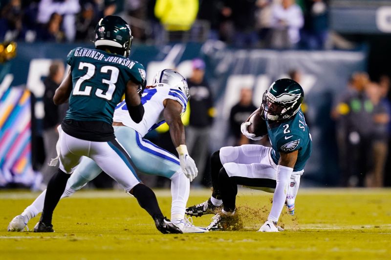 Philadelphia Eagles' Darius Slay, right, intercepts a pass intended for Dallas Cowboys' Michael Gallup during the first half of an NFL football game Sunday, Oct. 16, 2022, in Philadelphia. (AP Photo/Matt Slocum)