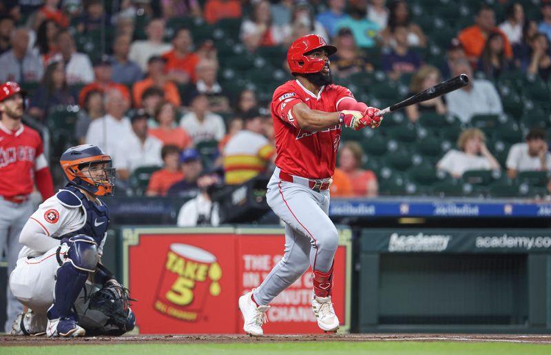 May 21, 2024; Houston, Texas, USA; Los Angeles Angels third baseman Luis Rengifo (2) hits a two-run home run during the first inning against the Houston Astros at Minute Maid Park. Mandatory Credit: Troy Taormina-USA TODAY Sports
