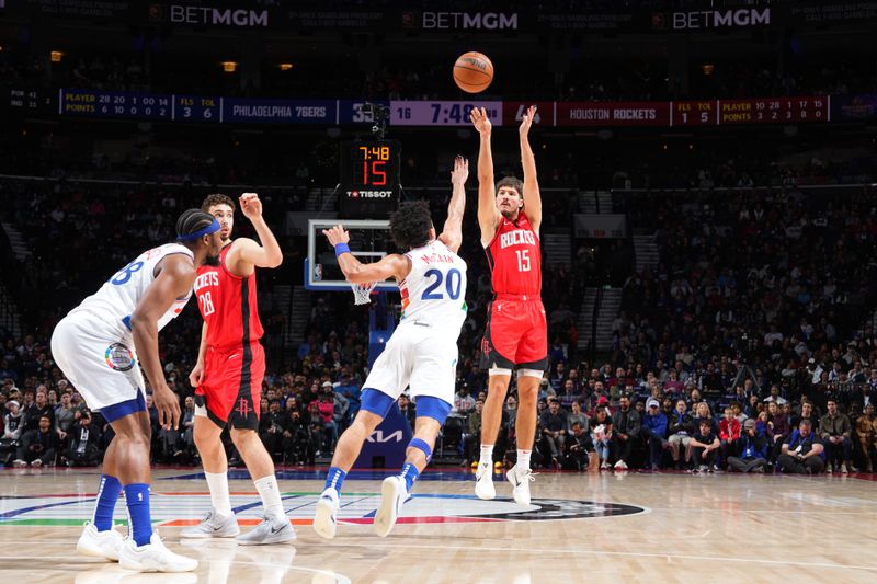 PHILADELPHIA, PA - NOVEMBER 27: Reed Sheppard #15 of the Houston Rockets shoots a three point basket during the game against the Philadelphia 76ers on November 27, 2024 at the Wells Fargo Center in Philadelphia, Pennsylvania NOTE TO USER: User expressly acknowledges and agrees that, by downloading and/or using this Photograph, user is consenting to the terms and conditions of the Getty Images License Agreement. Mandatory Copyright Notice: Copyright 2024 NBAE (Photo by Jesse D. Garrabrant/NBAE via Getty Images)