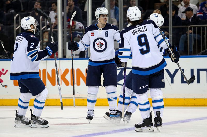 Mar 19, 2024; New York, New York, USA; Winnipeg Jets center Mark Scheifele (55) celebrates his second goal of the night against the New York Rangers during the second period at Madison Square Garden. Mandatory Credit: Danny Wild-USA TODAY Sports