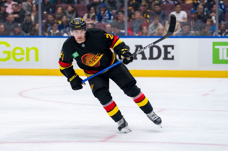 Oct 26, 2024; Vancouver, British Columbia, CAN; Vancouver Canucks forward Nils Hoglander (21) skates against the Pittsburgh Penguins during the third period at Rogers Arena. Mandatory Credit: Bob Frid-Imagn Images