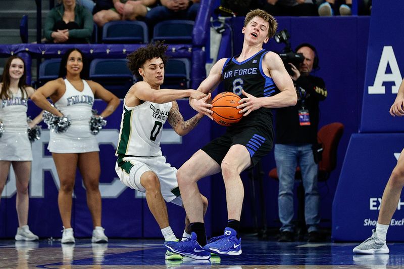 Feb 25, 2025; Colorado Springs, Colorado, USA; Air Force Falcons forward Will Cooper (6) is fouled by Colorado State Rams guard Kyan Evans (0) in the second half at Clune Arena. Mandatory Credit: Isaiah J. Downing-Imagn Images