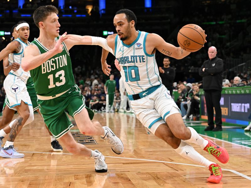 BOSTON, MASSACHUSETTS - APRIL 12: Amari Bailey #10 of the Charlotte Hornets drives to the basket against Drew Peterson #13 of the Boston Celtics during the fourth quarter at the TD Garden on April 12, 2024 in Boston, Massachusetts. NOTE TO USER: User expressly acknowledges and agrees that, by downloading and or using this photograph, User is consenting to the terms and conditions of the Getty Images License Agreement. (Photo by Brian Fluharty/Getty Images)