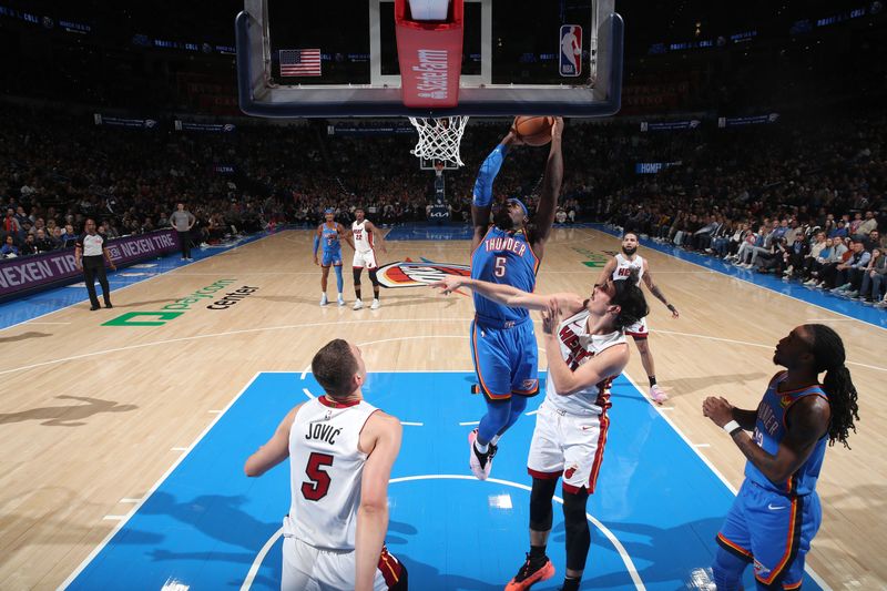 OKLAHOMA CITY, OK - MARCH 8:  Luguentz Dort #5 of the Oklahoma City Thunder drives to the basket during the game again the Miami Heat on March 8, 2024 at Paycom Arena in Oklahoma City, Oklahoma. NOTE TO USER: User expressly acknowledges and agrees that, by downloading and or using this photograph, User is consenting to the terms and conditions of the Getty Images License Agreement. Mandatory Copyright Notice: Copyright 2024 NBAE (Photo by Zach Beeker/NBAE via Getty Images)