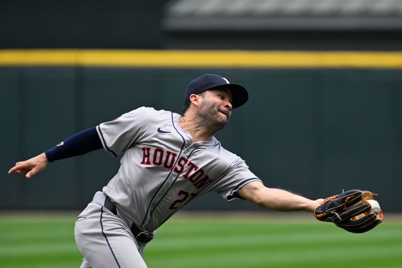 Jun 20, 2024; Chicago, Illinois, USA;  Houston Astros second base Jose Altuve (27) canít make the play on the ball hit by Chicago White Sox catcher Martin Maldonado (15) during the fifth inning at Guaranteed Rate Field. Mandatory Credit: Matt Marton-USA TODAY Sports