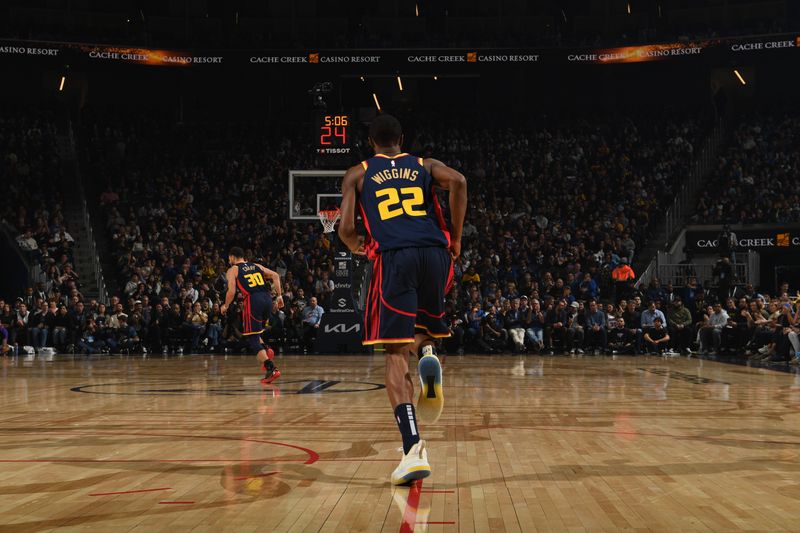 SAN FRANCISCO, CA - JANUARY 5:  Andrew Wiggins #22 of the Golden State Warriors looks on during the game against the Sacramento Kings on January 5, 2025 at Chase Center in San Francisco, California. NOTE TO USER: User expressly acknowledges and agrees that, by downloading and or using this photograph, user is consenting to the terms and conditions of Getty Images License Agreement. Mandatory Copyright Notice: Copyright 2025 NBAE (Photo by Noah Graham/NBAE via Getty Images)