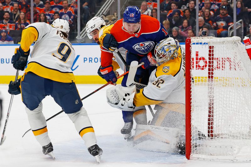 Jan 27, 2024; Edmonton, Alberta, CAN; Edmonton Oilers forward Zach Hyman (18) crashes into Nashville Predators goaltender Kevin Lankinen (32) during the first period at Rogers Place. Mandatory Credit: Perry Nelson-USA TODAY Sports