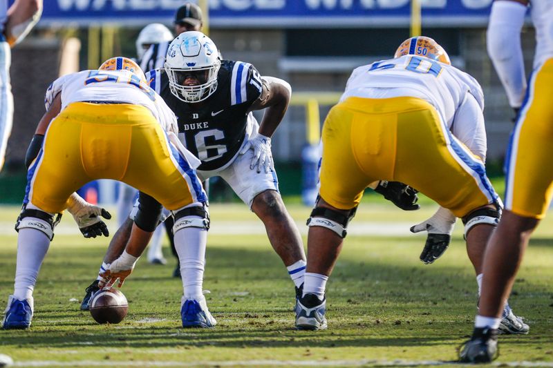 Nov 25, 2023; Durham, North Carolina, USA; Duke Blue Devils defensive tackle Aeneas Peebles (16) looks onto Pittsburgh Panthers offensive lineman Terrence Moore (58) during the second half of the game at Wallace Wade Stadium.  Mandatory Credit: Jaylynn Nash-USA TODAY Sports