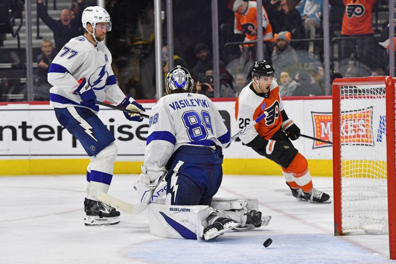 Feb 27, 2024; Philadelphia, Pennsylvania, USA; Philadelphia Flyers defenseman Sean Walker (26) celebrates his goal against Tampa Bay Lightning defenseman Victor Hedman (77) and goaltender Andrei Vasilevskiy (88) during the third period at Wells Fargo Center. Mandatory Credit: Eric Hartline-USA TODAY Sports