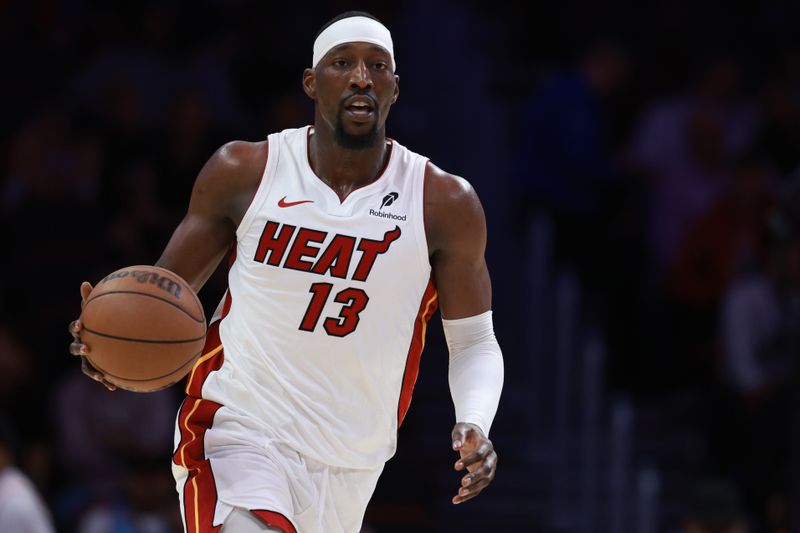 MIAMI, FLORIDA - OCTOBER 28: Bam Adebayo #13 of the Miami Heat controls the ball against the Detroit Pistons during the second half at Kaseya Center on October 28, 2024 in Miami, Florida. NOTE TO USER: User expressly acknowledges and agrees that, by downloading and or using this photograph, User is consenting to the terms and conditions of the Getty Images License Agreement. (Photo by Carmen Mandato/Getty Images)