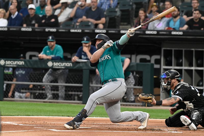 Aug 21, 2023; Chicago, Illinois, USA;  Seattle Mariners first baseman Ty France (23) singles against the Chicago White Sox during the first inning at Guaranteed Rate Field. Mandatory Credit: Matt Marton-USA TODAY Sports