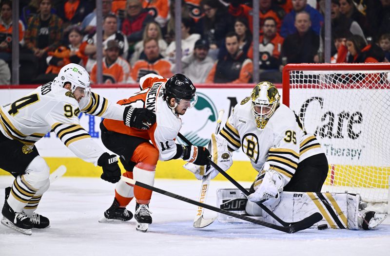 Jan 27, 2024; Philadelphia, Pennsylvania, USA; Boston Bruins goalie Linus Ullmark (35) saves a shot from Philadelphia Flyers right wing Travis Konecny (11) with Boston Bruins center Jakub Lauko (94) in the second period at Wells Fargo Center. Mandatory Credit: Kyle Ross-USA TODAY Sports