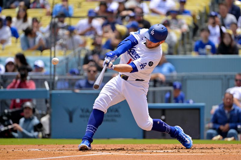 Apr 30, 2025; Los Angeles, California, USA; Los Angeles Dodgers third base Max Muncy (13) hits a solo home run against the Miami Marlins during the second half at Dodger Stadium. Mandatory Credit: Jayne Kamin-Oncea-Imagn Images